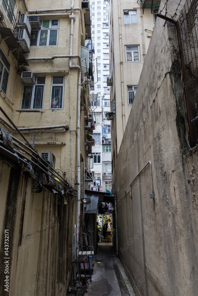 narrow backstreet in Kowloon, Hong Kong narrow backstreet in Kowloon, Hong Kong