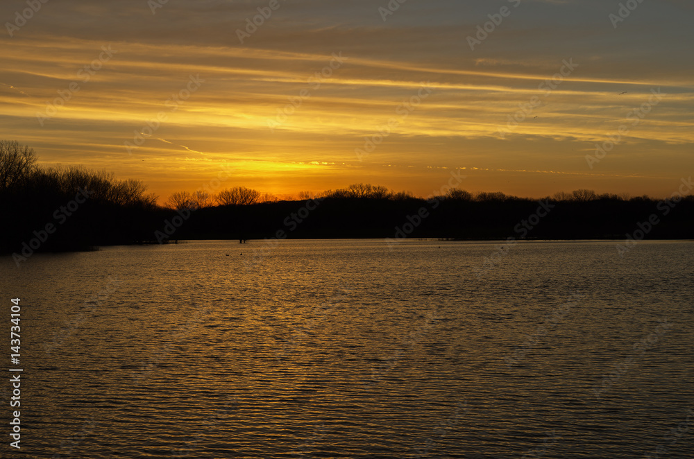 Sunrise over a lake near the Des Moines river Sunrise over a lake near the Des Moines river