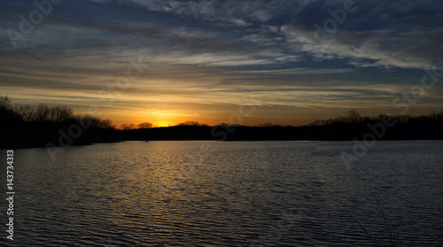 Sunrise over a lake near the Des Moines river photo