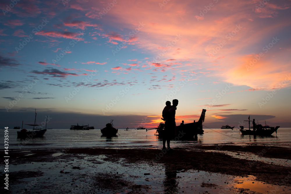 Fototapeta premium father and son walking and play at the beach sunset background