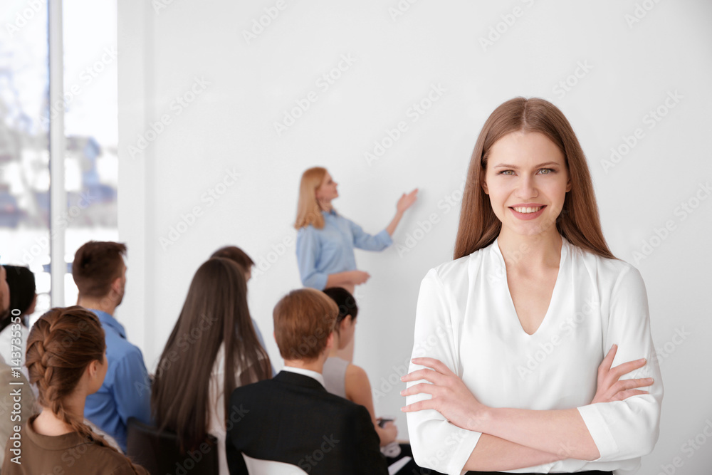 Young woman at business presentation Young woman at business presentation