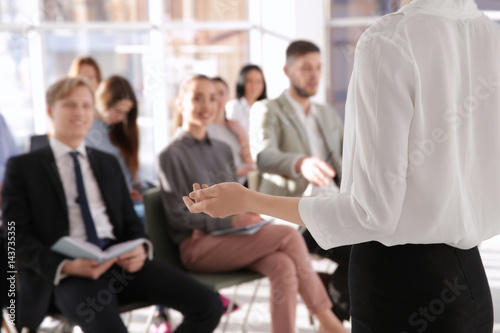 Business trainer giving presentation to group of people © Africa Studio