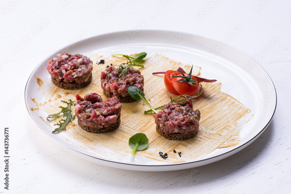 Meat sandwiches tartar on a white background Meat sandwiches tartar on a white background