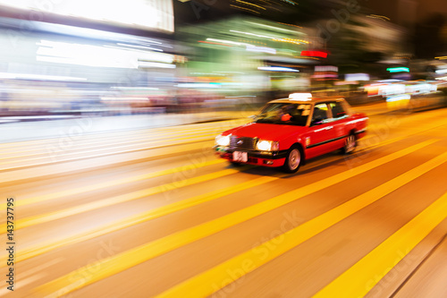 taxi in Hong Kong in motion blur at night © Christian Müller