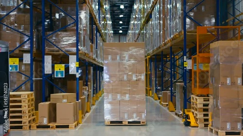 Aerial Footage Forklift Trucks Loads In The Rack Inside warehouse