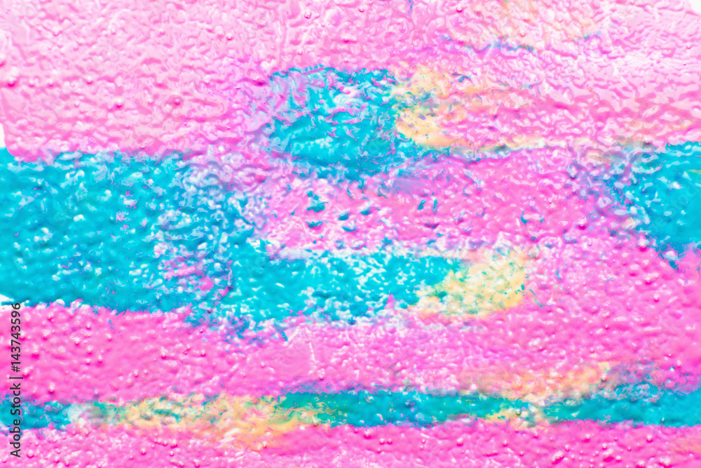 Curly texture of colorful paint mix free space. Bright mix of pink, blue and yellow paint. Art, creative, design, cosmetics, beauty concept