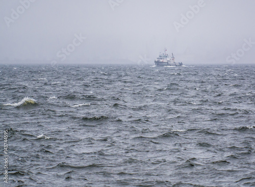 boat on the river and waves during a storm © Roman