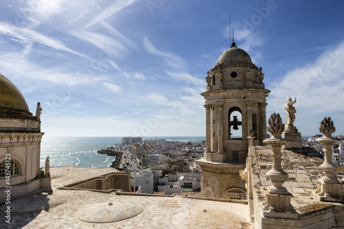This bell tower and statues in the roof of the Cathedral of Cadiz, completed in the nineteenth century is located very close to the sea, take in Cadiz, Andalusia, Spain Western Europe