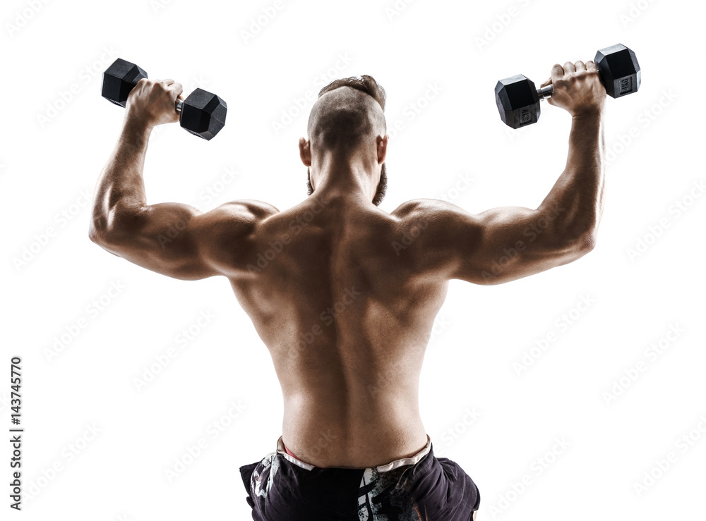 Sporty man in training pumping up muscles of the back and hands with dumbbells. Photo of strong male with naked torso isolated on white background. Strength and motivation.