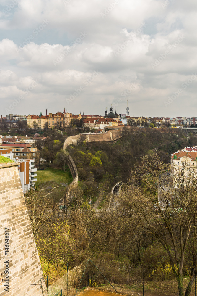 The view from  Vyshegrad rock to city of Prague in the early spring on a sunny day. Area of the old town in Prague, Czech Republic.
