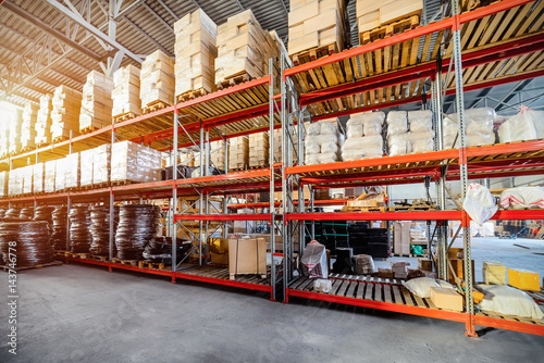 Long shelves with a variety of boxes and containers.