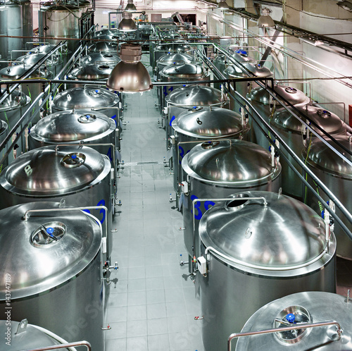 Rows of cisterns from food stainless steel.