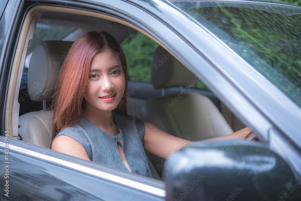 Woman Sitting In Car Getting Ready To Drive   