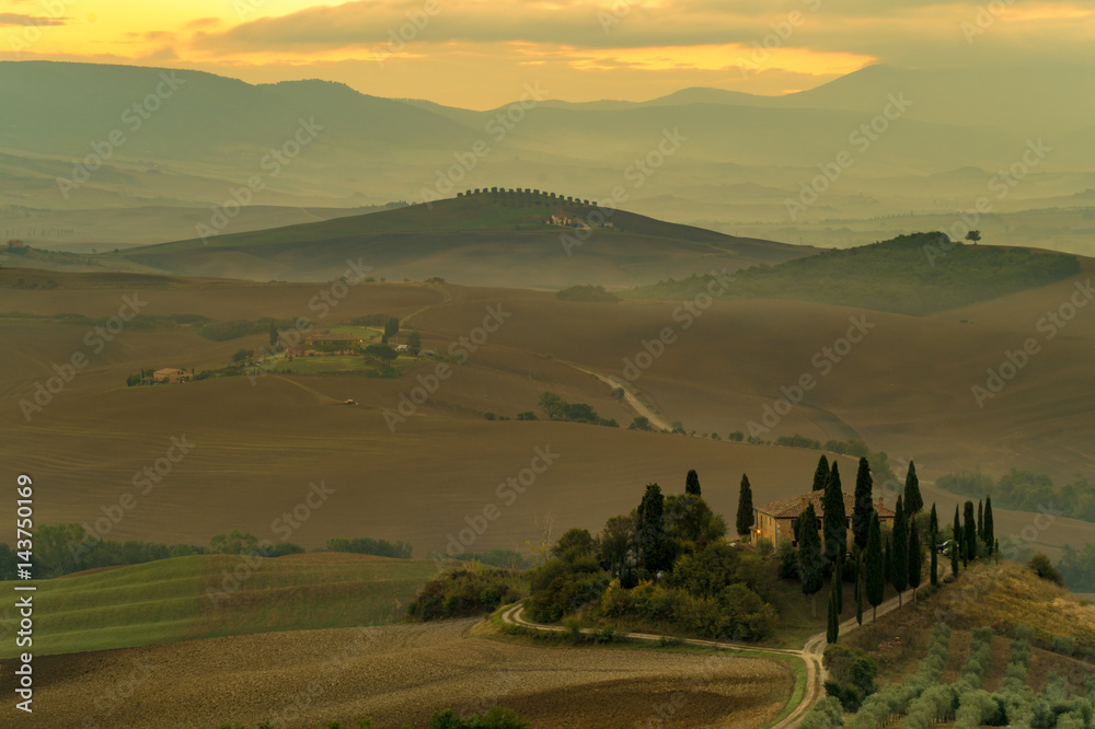 Cloudy and misty morning in the Tuscan Val d'Orcia Valley, Italy