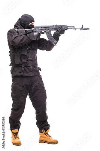 Terrorist with weapon on a white