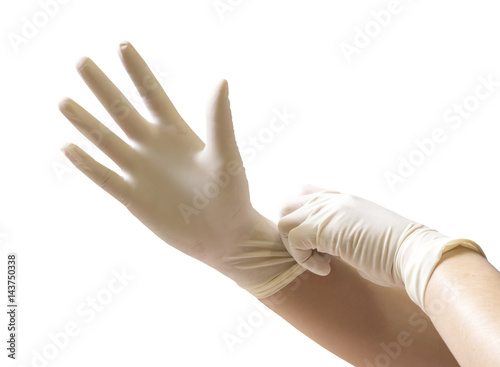 Doctor putting on sterile gloves isolated on white background