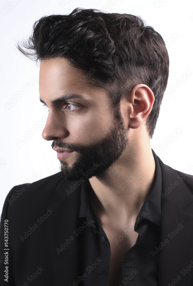 Fototapeta premium Side view portrait of stylish young man wth a modern hairstyle 