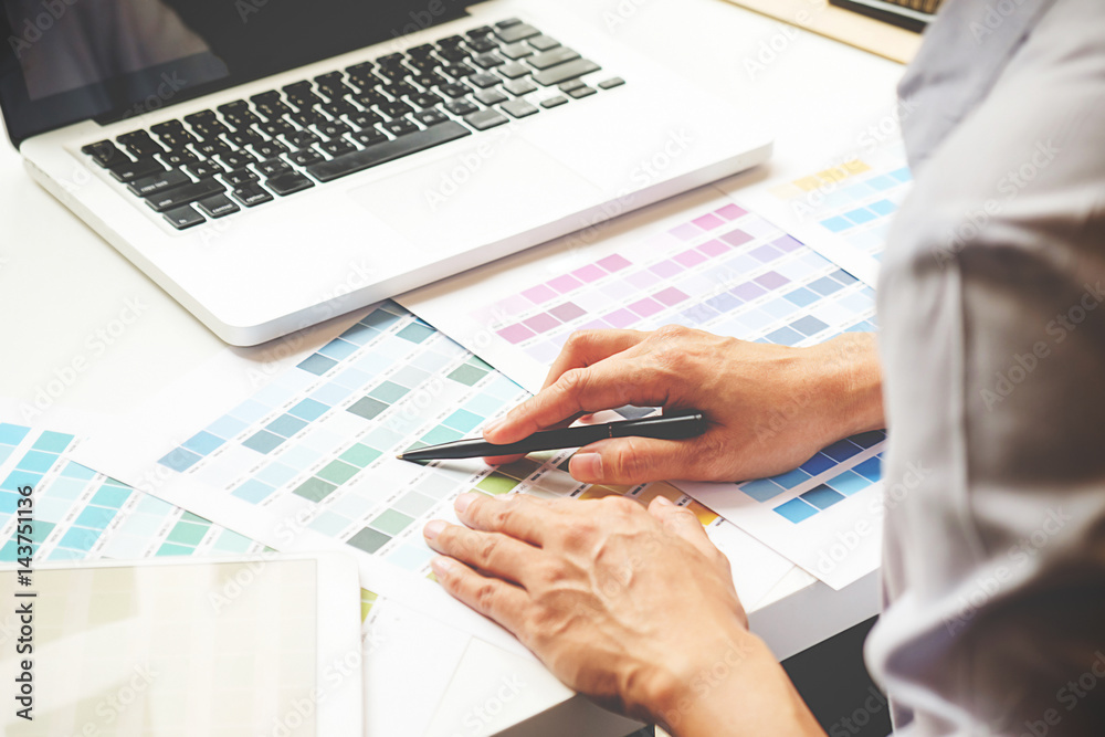 Graphic design and color swatches and pens on a desk. Architectural drawing with work tools and accessories selective focus. Graphic design and color swatches and pens on a desk. Architectural drawing with work tools and accessories selective focus.