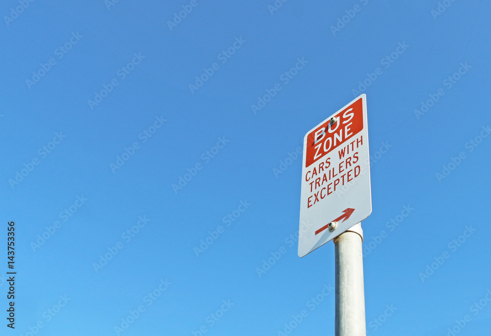 red and white Bus Zone sign in a blue sky red and white Bus Zone sign in a blue sky