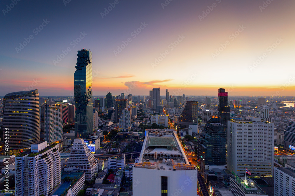 Obraz premium Aerial view of Bangkok modern office buildings, condominium, living place in Bangkok city downtown with sunset scenery, Bangkok is the most populated city in Southeast Asia.Bangkok , Thailand