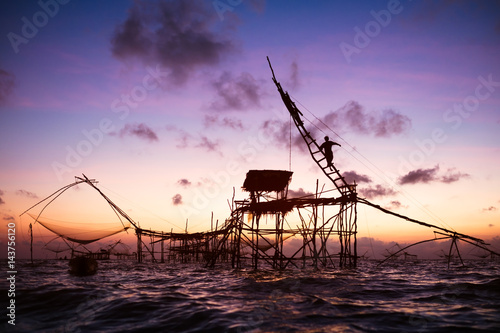 Silhouette of Square nets and sky background at sunrise, Pakpra, phattalung, Thailand. © Tee11