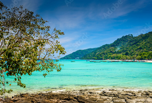 Fototapeta Naklejka Na Ścianę i Meble -  Beautiful tropical beach, rocks and clear turquoise sea water. Photo from Ko Phi Phi Don, Phi Phi Islands, Krabi province, Southern Thailand.