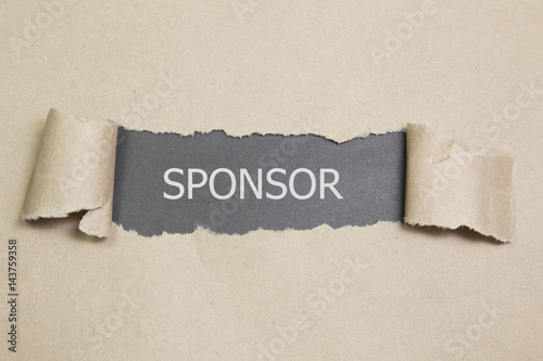 sponsor written under torn paper,  sponsorship concept. photo