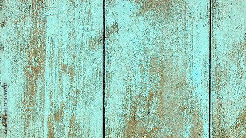 Old wooden wall painted in turquoise color  detailed background photo texture. Wood plank fence close up.