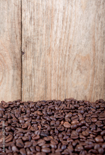 Coffee beans on wood background photo