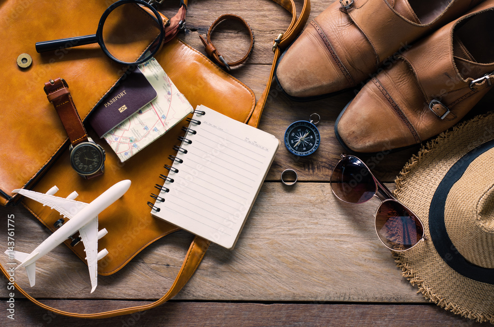 Travel accessories on wooden floor ready for travel Travel accessories on wooden floor ready for travel