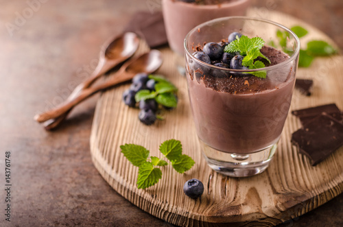 Chocolate pudding with berries and herbs