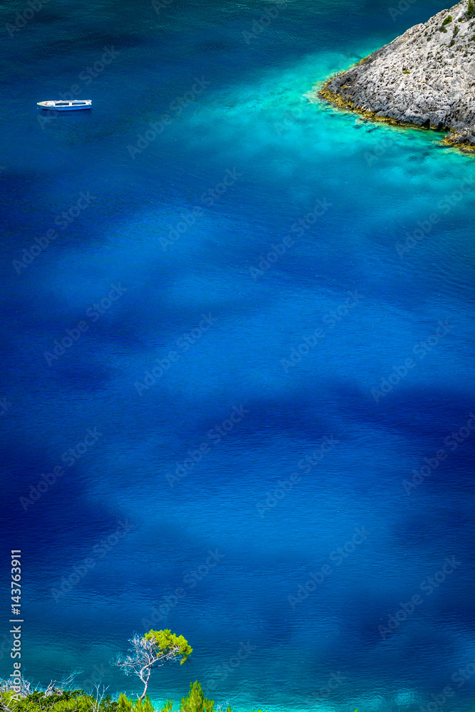 Clear turquoise water in the blue lagoon of Porto Vromi, Zakynthos (Zante) Island, Greece. Marine background.