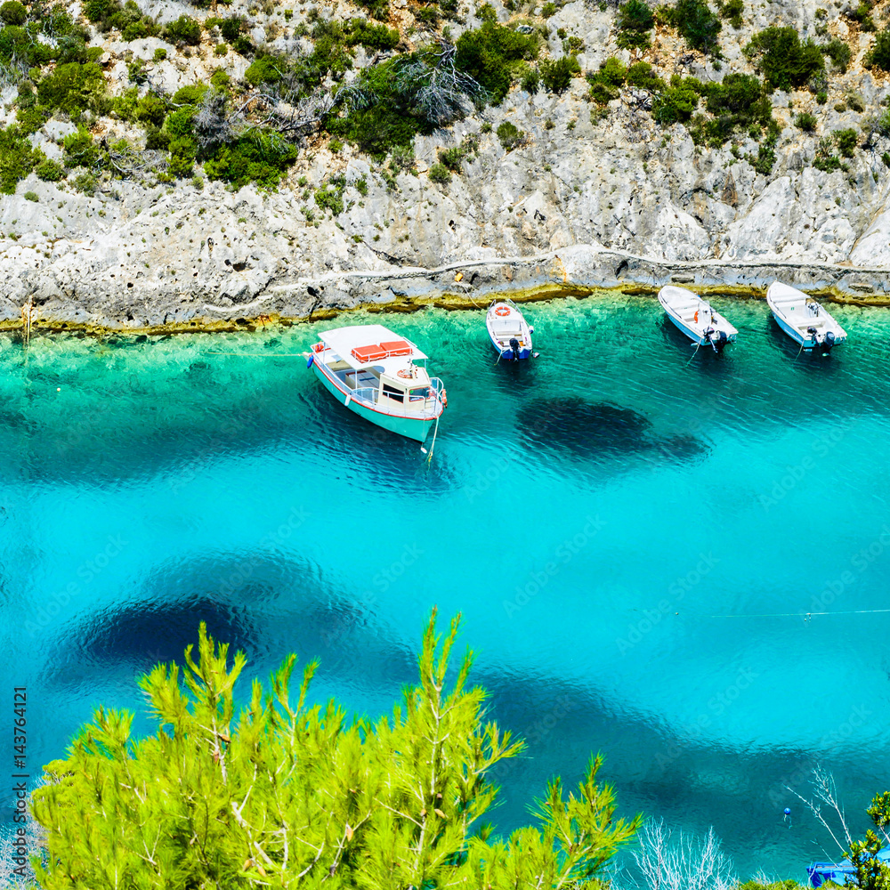 Boats and turquoise water in the blue lagoon of Porto Vromi, Zakynthos (Zante) Island, Greece