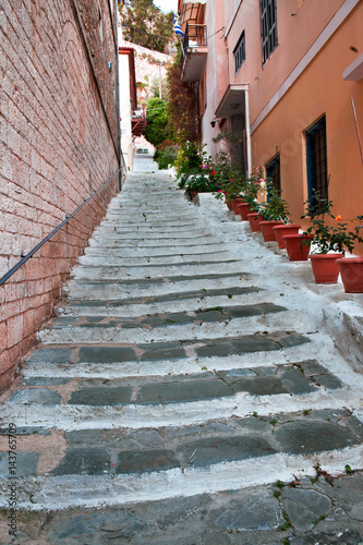 Flower pots and stairs: neighbourhood street in the Nafplion old town
