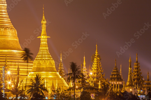 Yangon, Myanmar view of Shwedagon Pagoda at night with spotlight reflects gold surface of The pagoda