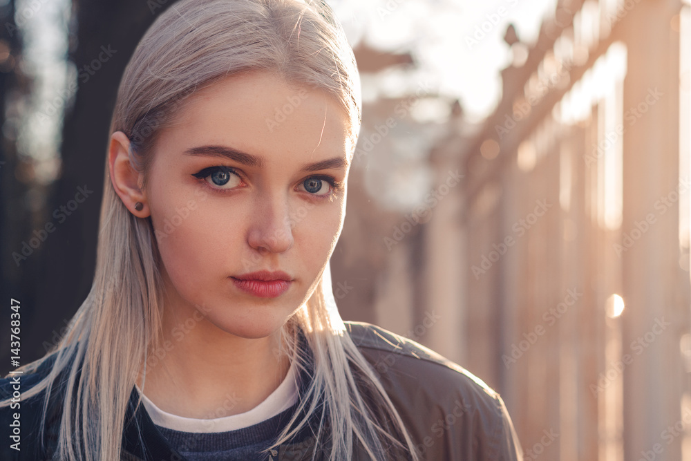 Beautiful attractive young girl in the evening in the city Beautiful attractive young girl in the evening in the city