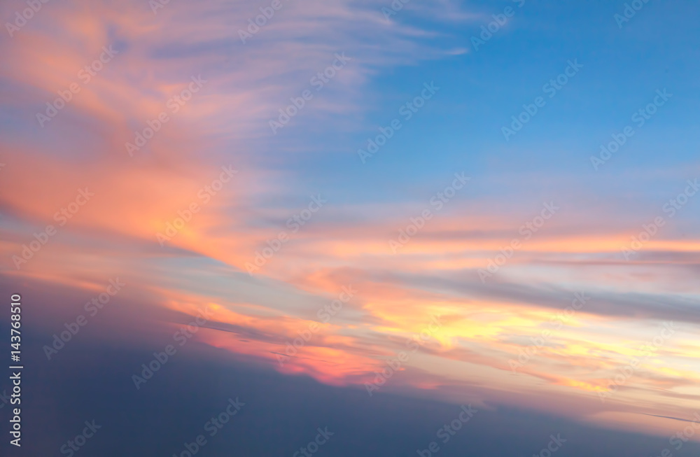 Burning clouds and blue sky after sunset