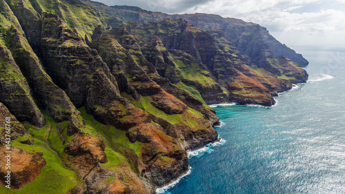 View of the monumental Na Pali Coast, aerial shot from a helicopter, Kauai, Hawaii.
