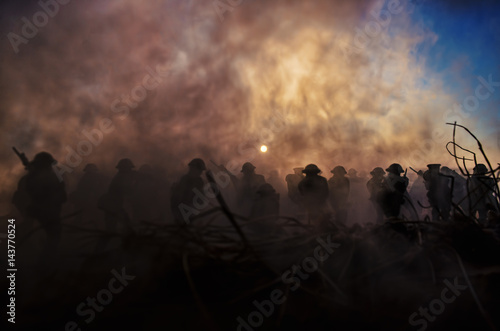War Concept. Military silhouettes and tanks fighting scene on war fog sky background, World War Soldiers Silhouettes Below Cloudy Skyline At Dusk or Dawn. Attack scene © zef art