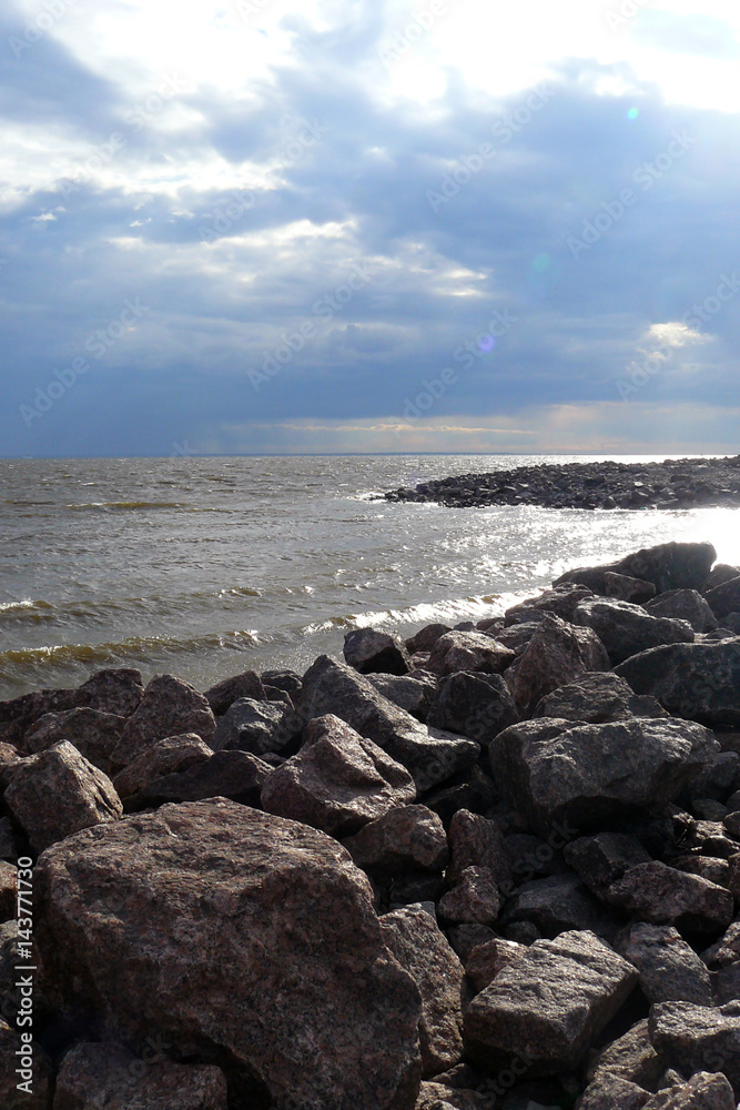 Sea, huge stones, clouds, water splash Sea, huge stones, clouds, water splash