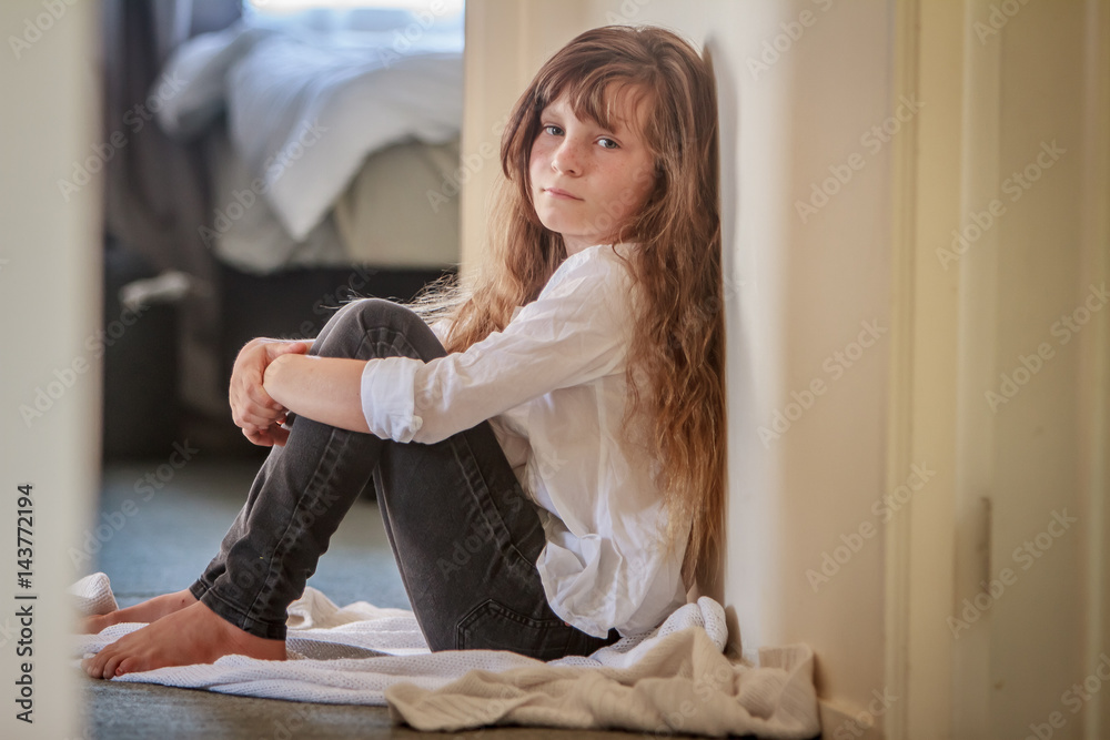 indoor portrait of young preteen girl at home