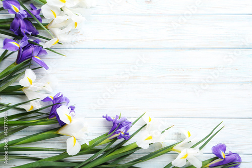 Fototapeta Naklejka Na Ścianę i Meble -  Bouquet of iris flowers on white wooden table