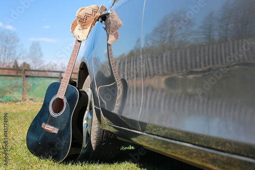 guitar outdoor near car photo