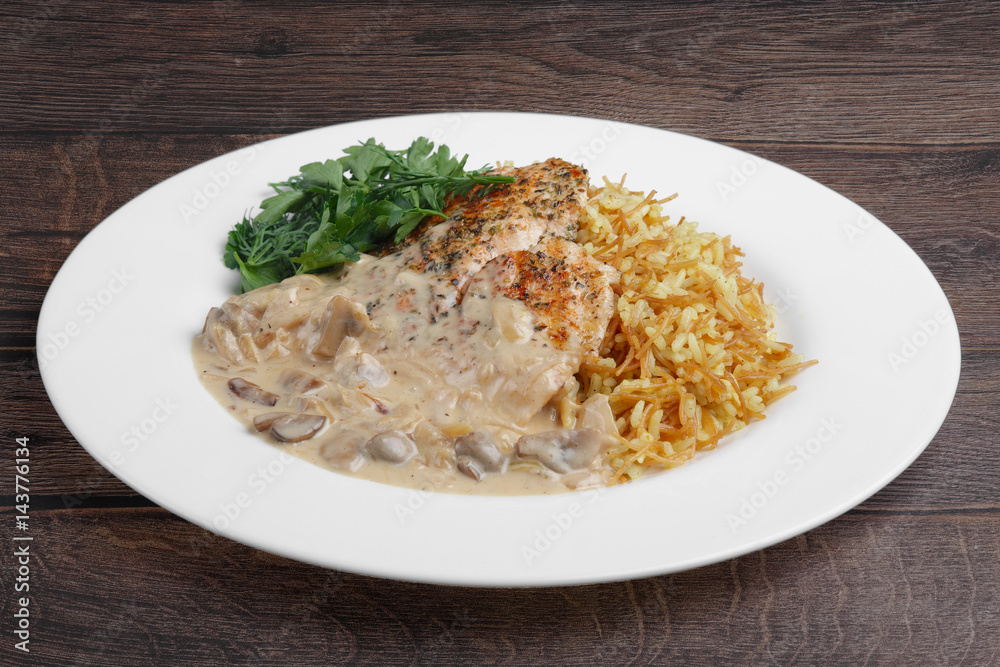 Spicy chicken fillet with risotto and mushroom sauce Spicy chicken fillet with risotto and mushroom sauce