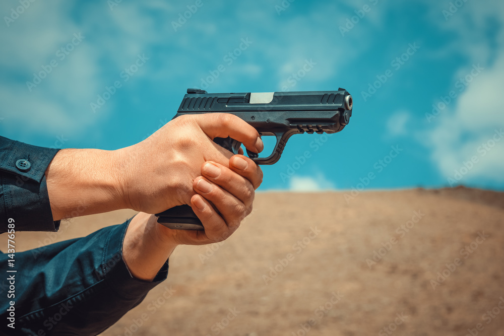 man targeting pistol outdoors man targeting pistol outdoors