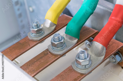 Connecting the wires with the bolts and nuts to the copper.