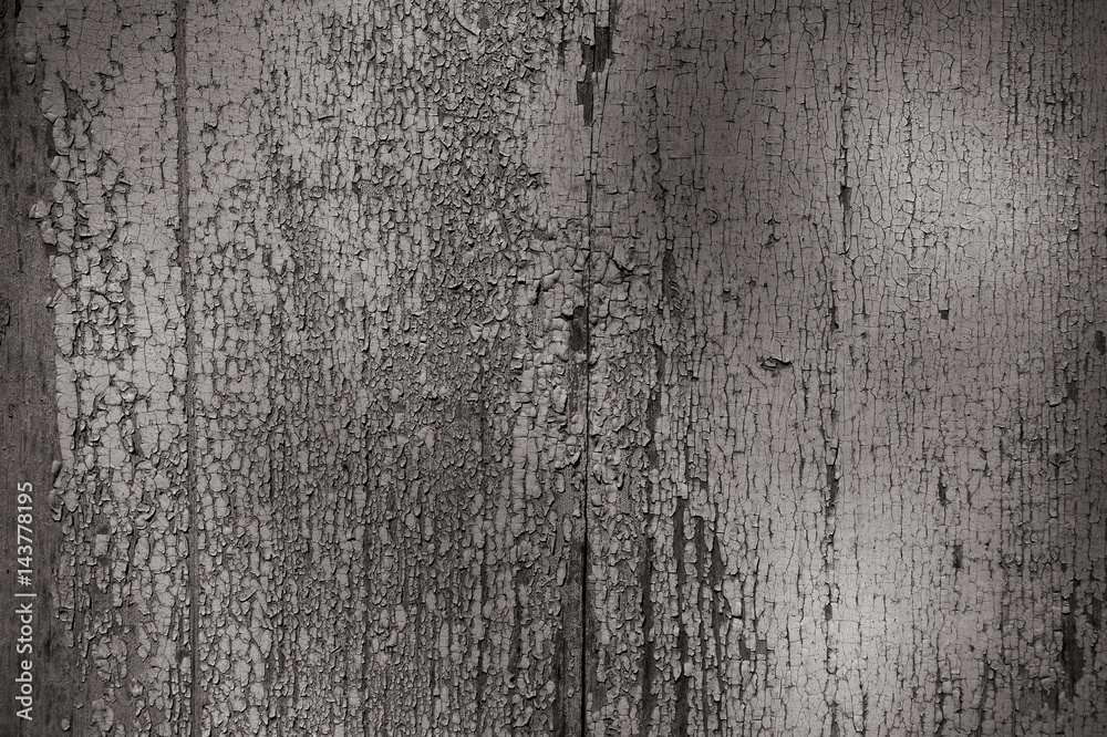 Naklejka premium a unique background texture of cracked white paint on the painted wall