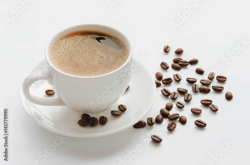 Coffee cup and saucer , coffee beans on a white background.