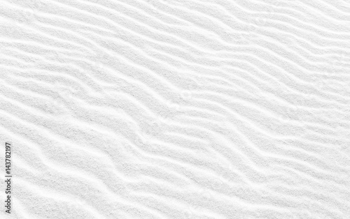 Wavy texture of white sand. Abstract background image photo