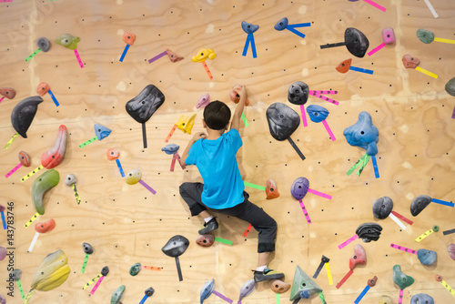 Young Boy Bouldering